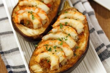 Melanzane gamberi e pomodori al forno