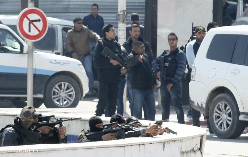Police officers are seen outside parliament in Tunis