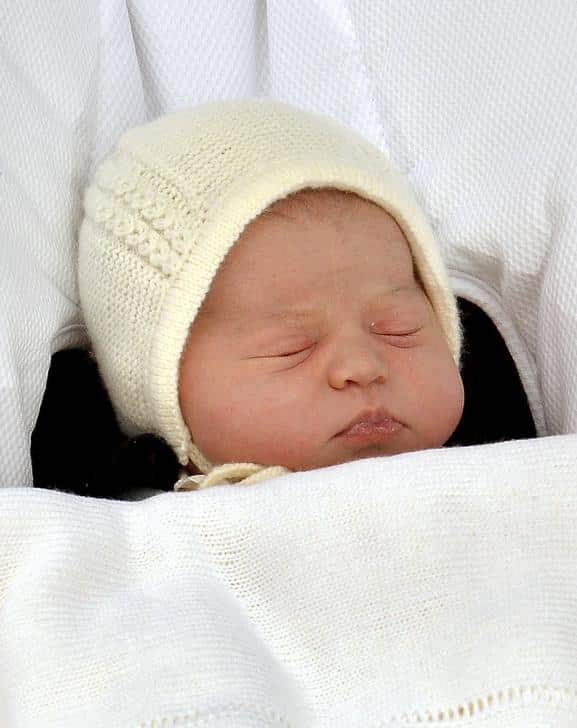 The baby daughter of Britain’s Prince William and Catherine, Duchess of Cambridge sleeps as she is carried from the Lindo Wing of St Mary’s Hospital in London