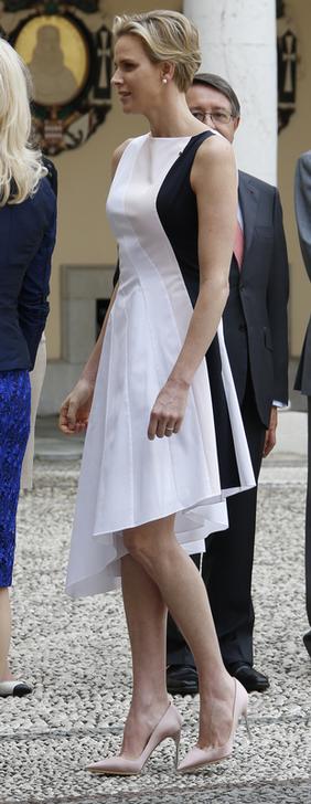 Princess Charlene of Monaco walks in the main courtyard of the Monaco Palace during a one day visit of Montenegro’s President Filip Vujanovic