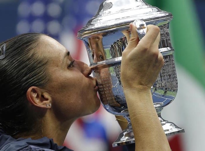Flavia Pennetta of Italy kisses her U.S. Open Trophy after defeating compatriot Roberta Vinci in their women's singles final match at the U.S. Open Championships tennis tournament in New York, September 12, 2015.       REUTERS/Mike Segar
