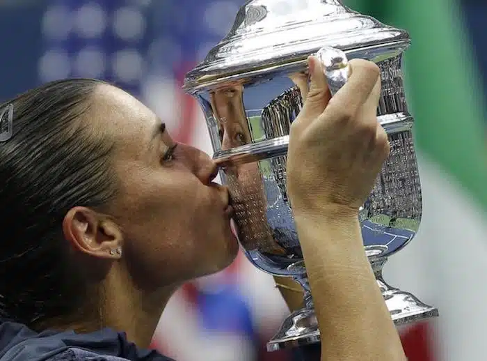 Flavia Pennetta of Italy kisses her U.S. Open Trophy after defeating compatriot Roberta Vinci in their women's singles final match at the U.S. Open Championships tennis tournament in New York, September 12, 2015. REUTERS/Mike Segar