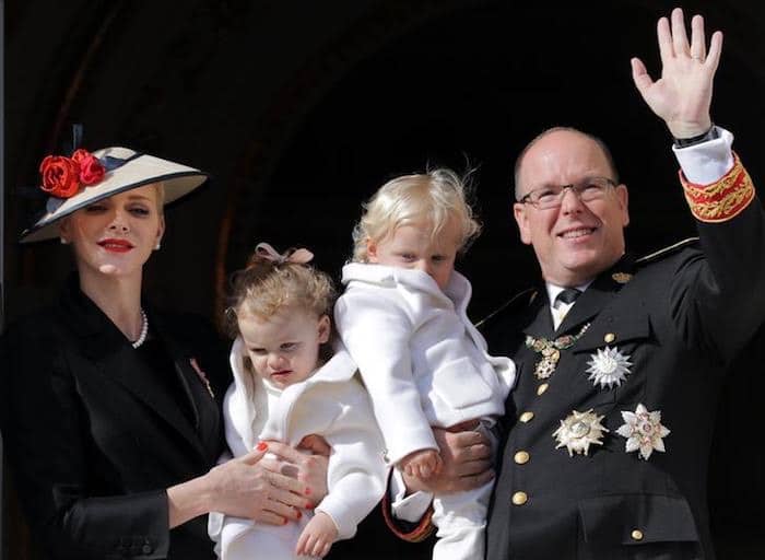 Prince Albert II of Monaco and his wife Princess Charlene hold their twins Prince Jacques and Princess Gabriella as they stand at the Palace Balcony during Monaco’s National Day