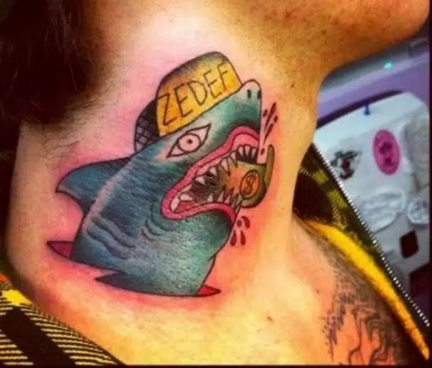 fedez tatuaggio squalo banconota